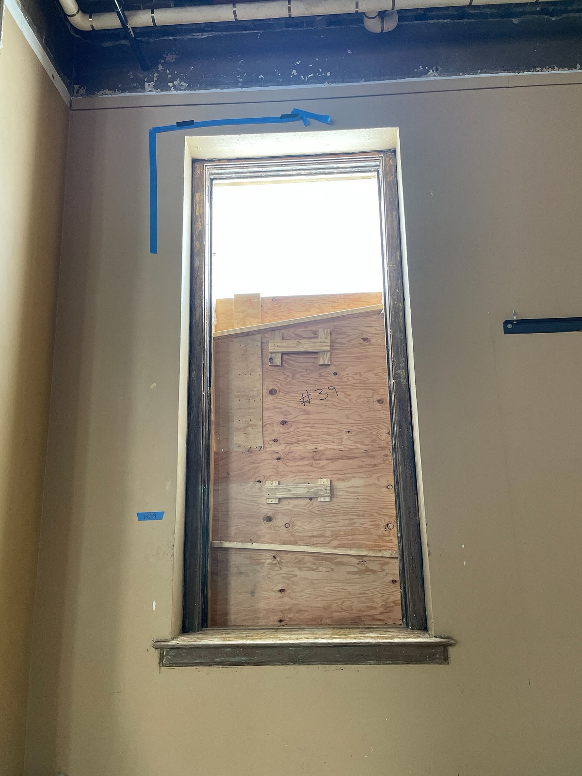 Window trim prepared during lead-paint removal at a historic courthouse